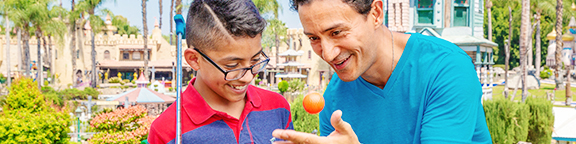 Father and Son playing mini golf